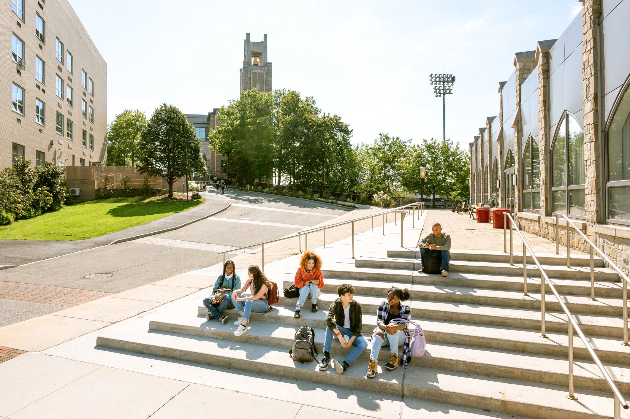 University students seated on campus steps